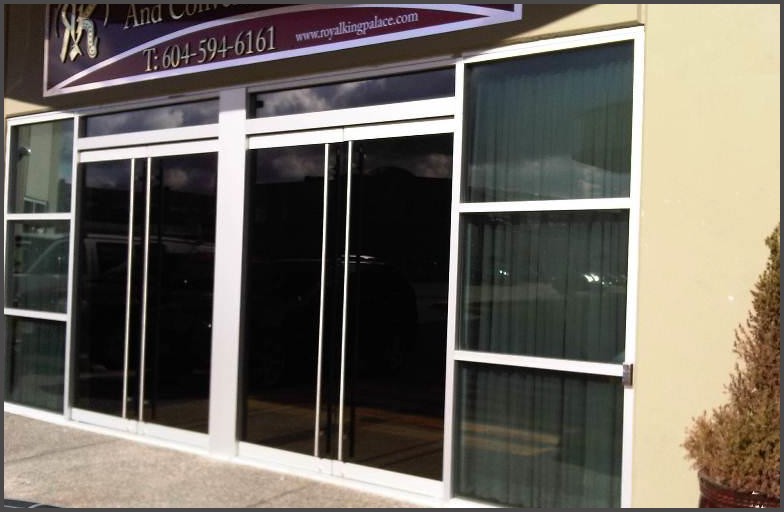 Parminder - Restaurant Entrance Door Redesign. Glass door was designed, cut and built with handles, hinges and pivots. Old glass door were removed and new glass doors were installed.