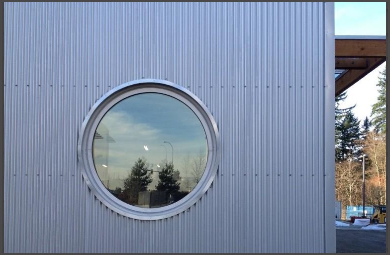 STORAGE FOR YOUR LIFE- curve window, round window, aluminum window, whichever you'd call it, Angel Glass could install them all. Such as this round commercial aluminum window.