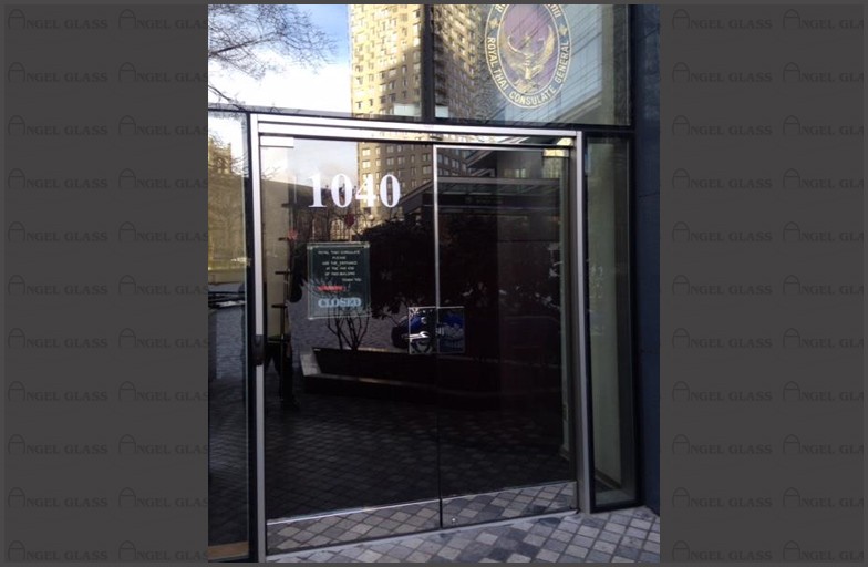 Thai Consulates - Secured Entrance Glass Door. Glass door installed with lever handles connects to existing intercom, door metal frames, concealed closers, hinges were all included. Front glass door.