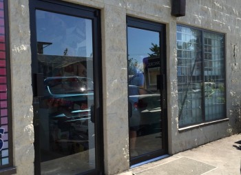 Entrance Door – New Storefront Aluminum Glass Door Replacement with Narrow Stile aluminum frames, new handles and closers were installed