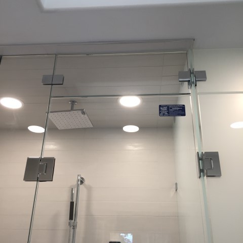 Bathroom shower door, frosted glass shower door. Installed by Angel Glass custom shower door company.