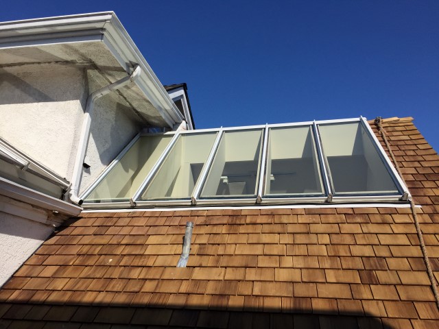 Residential Glass Skylight Replacement for Townhouse. Roof glass skylight with custom safety glass installed by Angel Glass.