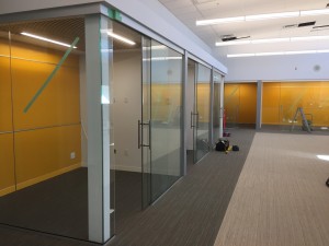 Interior private school office glass wall, glass sliding door, glass writing board on walls. All were designed with the owner's architects along with Angel Glass drawing designers. Once approved Angel Glass cut, build and installed all sliding glass doors, office glass walls, colored writing glass boards for this school's office.