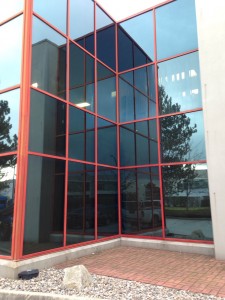 Glass replacement by Angel Glass. Large commercial aluminum curtain wall widow system with colored privacy glass needing replacement. Old double pane glass was removed and brand new colored double pane glass was installed. 