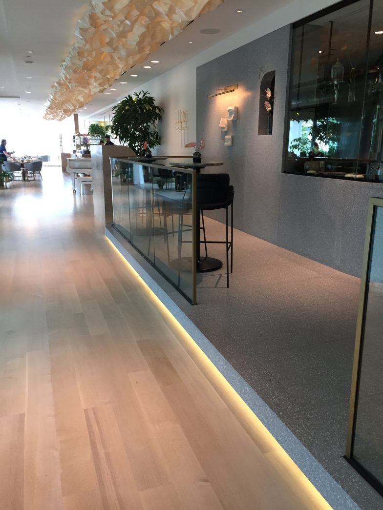 Transitioning from flat glass to beautiful curved glass for this restaurant bar area that requires structural sound glass railing systems that incorporate curve frames with curved glass to flat railing frames to flat railing glass.